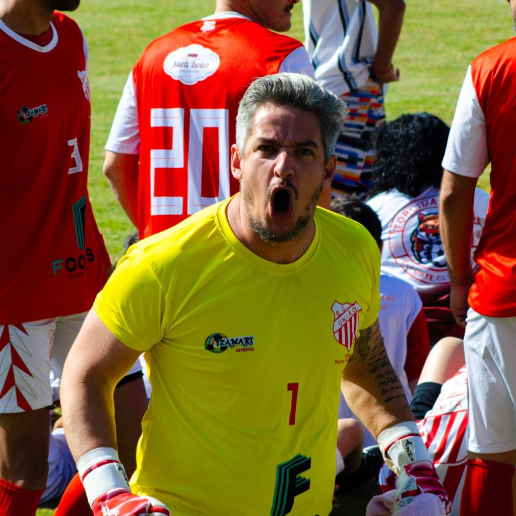 Goalkeeper in action with team during a competitive soccer match outdoors. — The Best Place for Sports Fans to Connect: La Gr